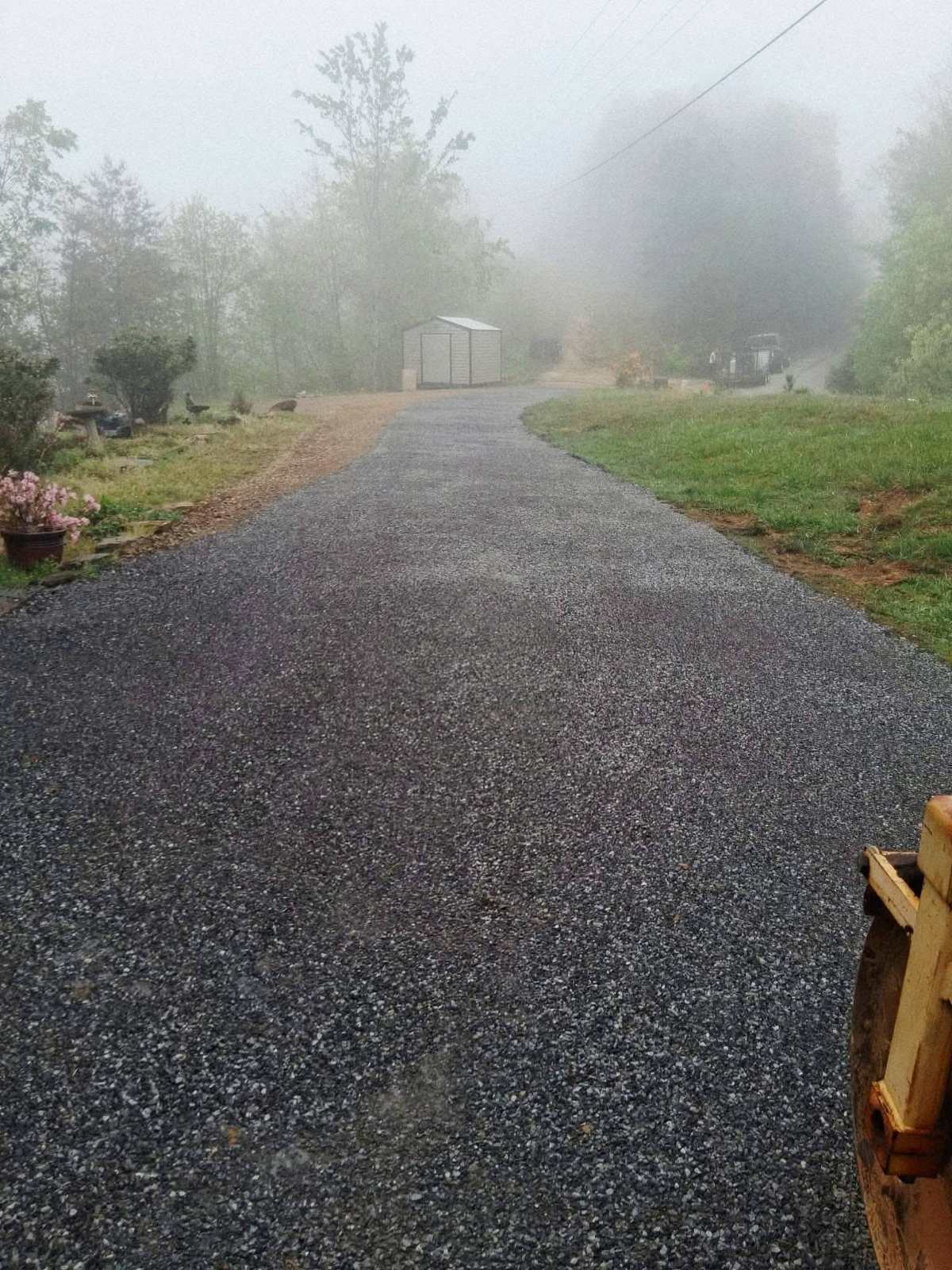 Finished chip-seal drive on a misty Cherokee County, NC mountain morning